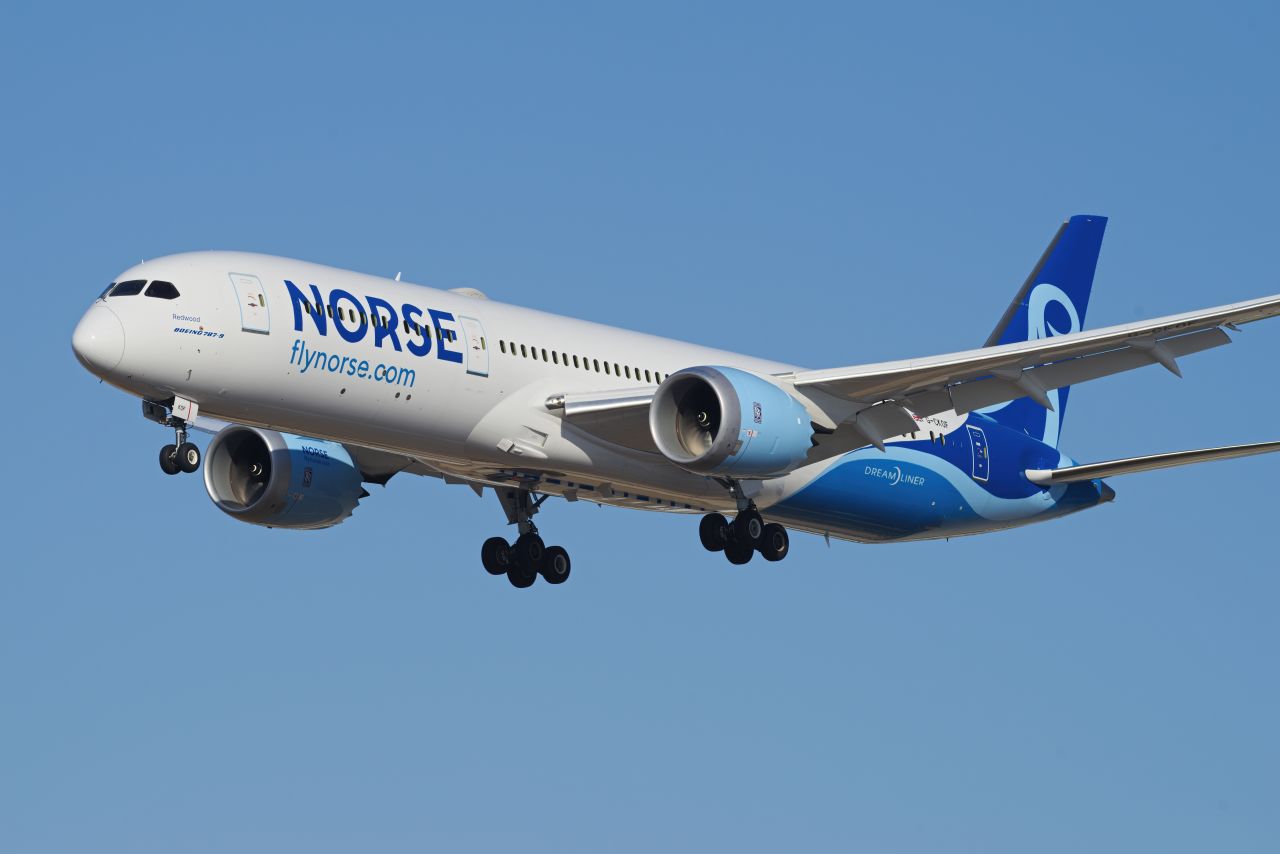 Norse Atlantic Boeing 787 Dreamliner in flight against clear blue sky